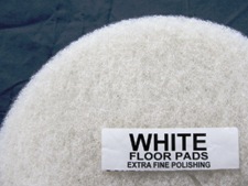 top half of white floor pad, label displayed